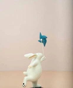 The Golden Triangle India Rabbit Holding A Pinwheel - Blue Artefacts