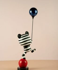 The-Golden-Triangle-India Artefacts Coco Holding A Balloon