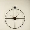 The Golden Triangle India Wall Clocks Nova Metal Wall Clock With Wooden Hands - Black 1 The Golden Triangle India Wall Clocks Nova Metal Wall Clock With Wooden Hands - Black