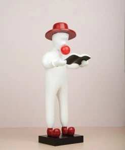 The-Golden-Triangle-India Willy - Figurine With A Hat Reading Artefacts